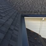 Black Gutter Topper with White Seamless Aluminum Gutters