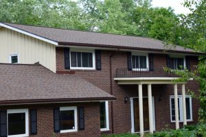 New Royal Brown Seamless Gutters by Dennison Exterior Solutions & Gutter Topper 