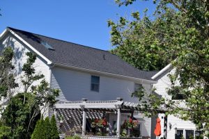 Back of Roof with Older Vents Removed and Ridge Vent Installed byDennison Exterior Solutions & Gutter Topper