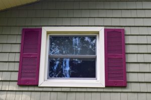 3 inch Vinyl Lineals with Burgundy Vinyl Shutters byDennison Exterior Solutions & Gutter Topper