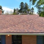 Front of a Berrien Springs, MI brick ranch home with new seamless gutters, Solution gutter guards and aluminum soffit and fascia