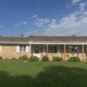 Front of a St. Joseph, MI brick ranch with new vinyl siding, soffit, fascia and seamless gutters