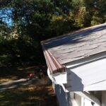 Benton Harbor MI Seamless Gutters Needle Guard Fascia Soffit 04 Corner of a new seamless gutter and white aluminum fascia in Benton Harbor, MI