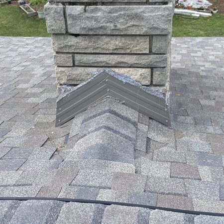 New chimney flashing on a NorthGate Driftwood roof in Berrien Springs, MI