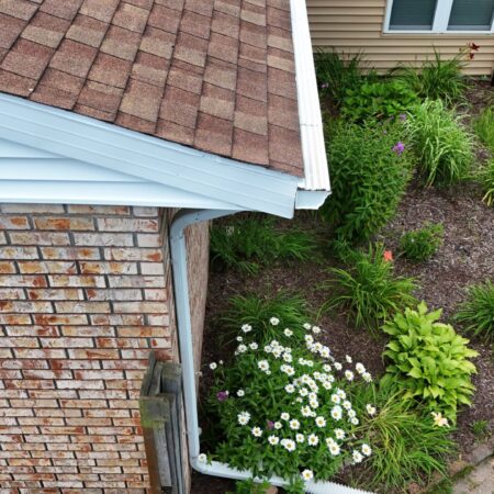 New White seamless gutters with Solution gutter guards on a St. Joseph, MI home