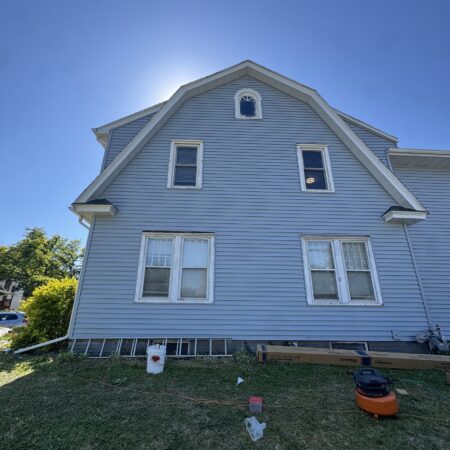 Gable end with new CertainTeed Monogram Dutch lap vinyl siding in Oxford Blue in South Bend, IN