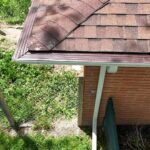 New Desert Tan seamless gutter and downspout with gutter guard in Berrien Springs, MI