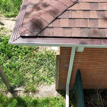 New Desert Tan seamless gutter and downspout with gutter guard in Berrien Springs, MI