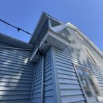 Back corner of a South Bend, IN home with new vinyl siding, vented soffit and fascia