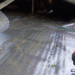 Berrien Springs MI Roof Gutter Topper 09 Heat Deflector Insulation laid over attic insulation in Berrien Springs, MI