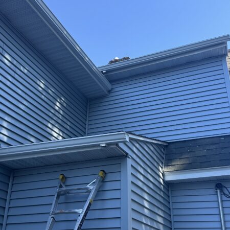 Rear corner with new vinyl siding, fascia and seamless gutter in South Bend, IN