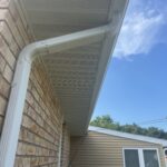 St. Joseph MI Siding Soffit Fascia Solution 09 Vented soffit and White downspout on a St. Joseph, MI home