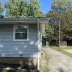 Benton Harbor MI Seamless Gutters Needle Guard Fascia Soffit 12 Side of a Benton Harbor, MI home with new white seamless gutters