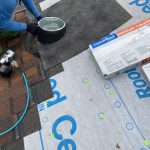 Round skylight being re-flashed during a CertainTeed roof installation in Coloma, MI