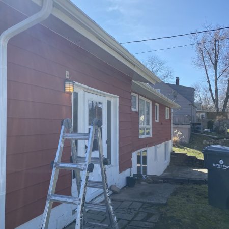 New White seamless gutter and downspout along the back of a St. Joseph, MI home