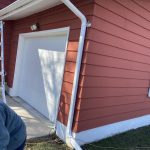 St Joseph MI Gutters Solution 07 New White seamless gutter and downspout at the garage corner in St. Joseph, MI