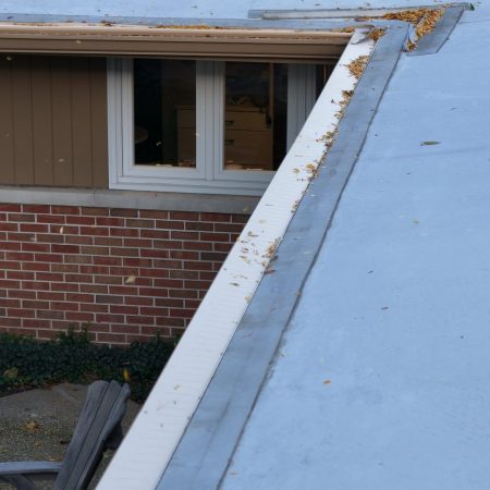 Tan Gutter Topper at an inside corner of a St. Joseph, MI home