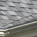 St. Joseph MI Roof Leaf Terminator 10 Close-up of new Pewter shingles at the eave edge above the gutter with Leaf Terminator gutter protection