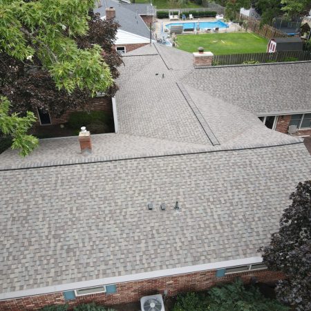 Aerial view of new NorthGate Weathered Wood roof and seamless gutters in Stevensville, MI