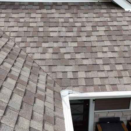 Roof valley and White Solution Cover over existing gutters in Valparaiso, IN